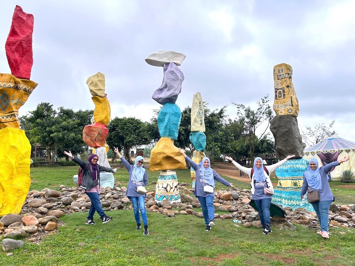 ZFB Travel private tour customers photo in front of stones at Mongo Land Dalat